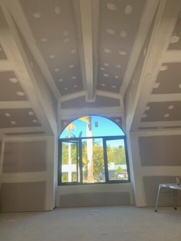 Arched window plaster feature in a residential build